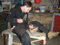 Cathal works on the gouging of his hull. Photo: SR